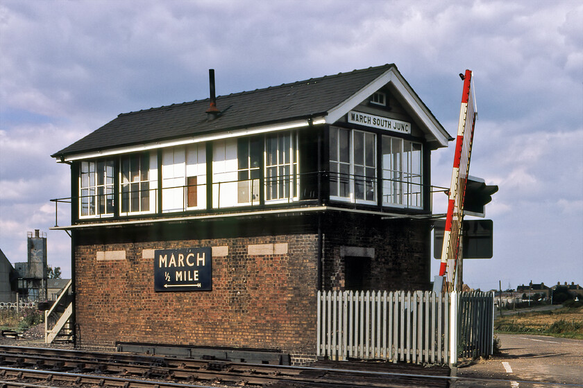 March South Junction signal box (GE, 1885) 
 March South Junction signal box is seen complete with its enormous British Railways (Eastern) enamel running-in sign. The Great Eastern box dates from 1885 and, at the time of writing in 2023, is still in use but very much on borrowed time. I took a very similar photograph in 2019, see.. https://www.ontheupfast.com/p/21936chg/25696225404/march-south-junction-signal-box and again in 2023, see ..... https://www.ontheupfast.com/p/21936chg/30041446455/x170618-10-27-stansted-airport-birmingham with very few differences observed but for the clearance of the March Concrete Plant that closed in the late 1980s in the background to be replaced by some bungalows. 
 Keywords: March South Junction signal box GE Great Eastern