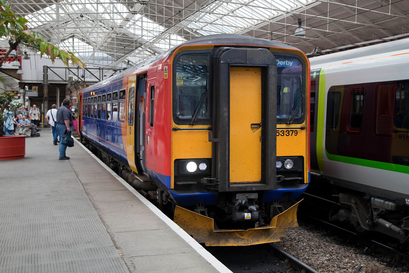 153379, EM 15.07 Crewe-Derby (1K18, 5L), Crewe station 
 A single car unit is all that formed the 15.07 from Crewe to Derby. Bizarrely, it is still classified as a class 1 'express passenger', working running as 1K18. Quite why 153379 on this working gets this train reporting number is a little beyond me. Either way, the passengers would not care or know but they would have been a little nonplussed that it arrived into Derby five minutes late. 
 Keywords: 153379 1K18 Crewe station