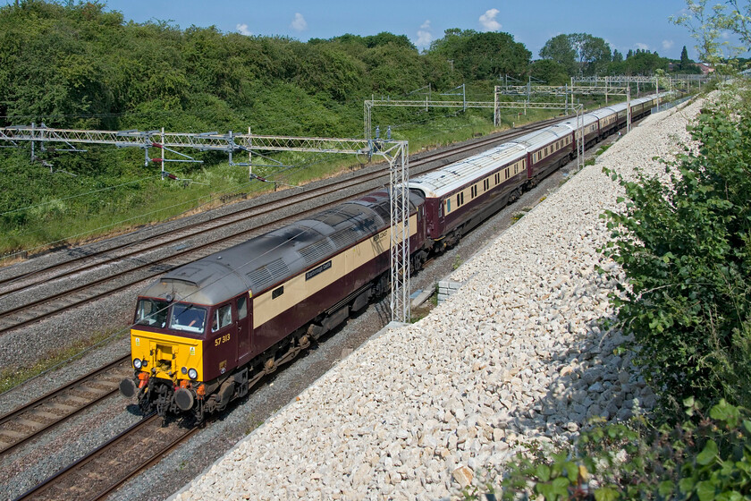 57313, 06.23 Manchester Victoria-Ascot (1Z50, 6L), Ashton Road bridge 
 Taking the wealthy and rich racegoers from the north to Ascot finds the 06.23 Manchester Victoria to Ascot passing Roade with West Coast Pullman liveried 57313 'Scarborough Castle' leading. Running as 1Z50 the punters on board would be treated to a number of cards on this, the middle day of the Ascot meet, with the 18/1 shot Desert Hero winning the King George V. 
 Keywords: 57313 06.23 Manchester Victoria-Ascot 1Z50 Ashton Road bridge Scarborough Castle West Coast Pullman livery