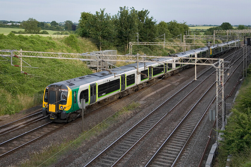 350250, LM 18.29 London Euston-Northampton, Victoria bridge 
 Yet another London Midland evening commuter service passes Victori bridge between Roade and Ashton worked by two Desiros with 350250 leading. As can be seen, it's an improving picture weather-wise with the weak evening summer sun providing some welcome soft contrast. 
 Keywords: 350250 18.29 London Euston-Northampton Victoria bridge London Midland Desiro