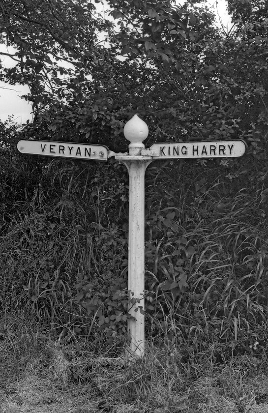 CCC cast signpost 
 Forgive the inclusion of the first of three non-railway photographs but ones that are of equal historical interest in my opinion at least! When travelling around the lanes of Cornwall undertaking various fieldwork activities I came across many old Cornwall County Council road signs. This particular example was somewhere on the minor road between the King Harry Ferry and the village of Veryan. Only local knowledge will tell me if it still exists today without following every road in this area on StreetView! 
 Keywords: CCC cast signpost