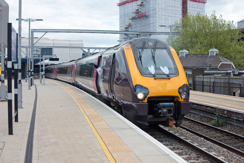 220023, XC 09.35 Newcastle-Southampton (1O86), Reading station 
 As the driver washes the windscreen of 220023, the guard peers down the train waiting for the RA. 220023 is about to leave Reading's newly built and opened platform three with the 09.35 Newcastle to Southampton working. I could think of better ways to make this cross-country journey from the northeast to the south coast than in a Voyager. I don't poses a pair of rose-tinted spectacles, but surely the travelling experience of loco. hauled stock of yesteryear must be better than the modern alternative? 
 Keywords: 220023 09.35 Newcastle-Southampton 1O86 Reading station