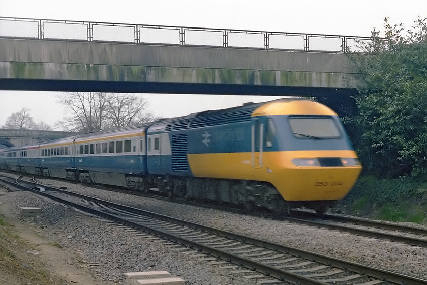 253014, unidentified up working, Bathampton Junction 
 An image that shows the totally impractical maximum shutter speed of the Exa 35mm camera that I was using. 253014 had only completed six weeks in service by this date and still looks very smart (if a little blurred!) as it speeds eastwards with an unidentified Paddington working passing Bathampton Junction. I was standing on the site of the old station at Bathampton that closed in October 1966. 
 Keywords: 253014 up working Bathampton Junction