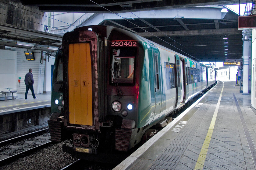 350402, LN 07.48 Wolverhampton-Walsall, (2A07, RT) Birmingham New Street station 
 My second London Northwestern Desiro of the day stands inside New Street station. With the slightly late arrival of my inbound train, I only had a few minutes to change platforms and catch the 07.58 Wolverhampton to Walsall service grabbing a hasty photograph as I walked towards the train. I travelled on board 350402 as far as Bescot Stadium station, my chosen spot for capturing an image of the charter. 
 Keywords: 350402 07.48 Wolverhampton-Walsall 2A07 Birmingham New Street station London Northwestern Desiro