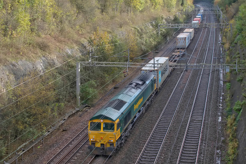 66512, 09.32 Felixstowe North-Ditton (4M88), Roade cutting 
 Freight one....
66512 leads the 4M88 09.32 Felixstowe to Ditton through Roade cutting. I had been tracking the progress of this freight on Open Train Times but was I was also watching 4L96 coming the other way and looked increasingly likely they were going to cross in the cutting. Indeed, coming the other way at the time I pressed the shutter, 4L96 was coming into view behind me..... https://www.ontheupfast.com/v/photos/21936chg/27910630804/x0002-66596-0012-0012-lawley-street 
 Keywords: 66512 09.32 Felixstowe North-Ditton 4M88 Roade cutting