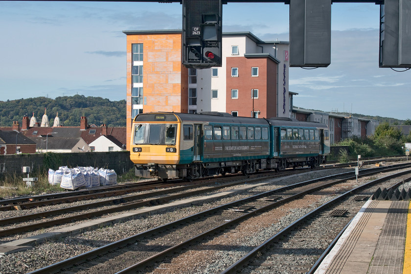 142076, AW 10.15 Coryton-Radyr (2V15, 3L), Cardiff Central station 
 142076 rattles away from Cardiff Central station with the 10.15 Coryton to Radyr 'City Line' service. These much-maligned units are supposed to out of squadron service by the 31st December this year (in three months' time) but they were very much in use during my half-hour on Central station. The unit is just about to pass a huge new student accommodation block that extends towards Cardiff West Junction. If I was a student at the university in Cardiff, I would have fancied bagging one of the rooms at the back of this block even it would not get much sun as it faces north! It would also be a great location for a railcam like the one at York, see.... https://www.youtube.com/watch?v=9zHb90p2HKQ 
 Keywords: 142076 10.15 Coryton-Radyr 2V15 Cardiff Central station