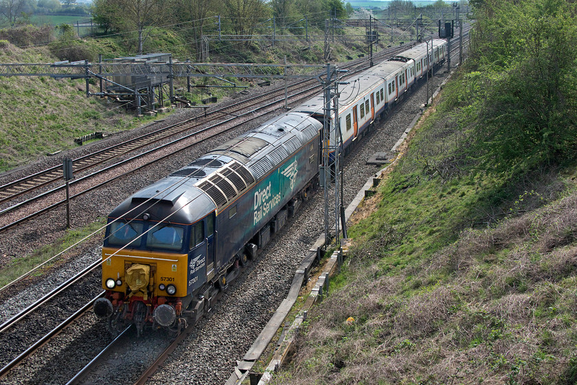 57301 & 315816, 10.56 Wembley yard-Masborough Booths (5Q25, 15E), Victoria bridge 
 This move had been noticed by a number of people on the forums and highlighted as one to watch out for. There was some uncertainty as to what it would be but it was presumed that it would be a former Greater Anglia or TfL unit(s). Operated by Rail Operations Group (ROG) the 10.56 Wembley to Booth's Yard in Rotherham move was removing a redundant former TfL unit for scrapping. 57301 'Goliath' tows 315816 past Victoria bridge just north of Hanslope Junction on the down fast line. 
 Keywords: 57301 315816 10.56 Wembley yard-Masborough Booths 5Q25 Victoria bridge Goliath