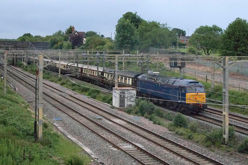 47812, return leg of The Northrn Belle, 18.45 London Victoria-Manchester Victoria (1Z62, 5E), site of Roade station 
 Having been mustered earlier in the day to haul the train following the failure of 57314 'Conwy Castle' at Stoke-on-Trent 47812 takes a rest at the rear of the returning Northern Belle charter that left London Victoria at 18.45 heading back to Manchester Victoria. The train is seen in the half-light on a particularly dismal spring evening passing Roade with the table lights of the stock clear to see! 
 Keywords: 47812 The Northern Belle 18.45 London Victoria-Manchester Victoria 1Z62 site of Roade station