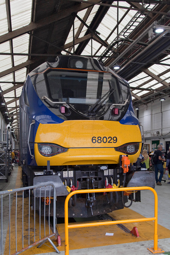 68029, on-display, DRS Open-Day, Gresty Bridge 
 Built as a joint venture between Vossloh Espaa and Stadler Rail Group the class 68s will receive no accolades for their elegance! In my eyes, for a modern design, they appear clumsy. But, who am I to comment as one who cut his spotting teeth on the simple but beautiful smooth and uncluttered lines of Westerns! Here, 68029 'Destroyer' is seen tucked just inside the maintenance shed at DRS's Crewe Gresty Bridge depot. 
 Keywords: 68029 DRS Open-Day, Gresty Bridge