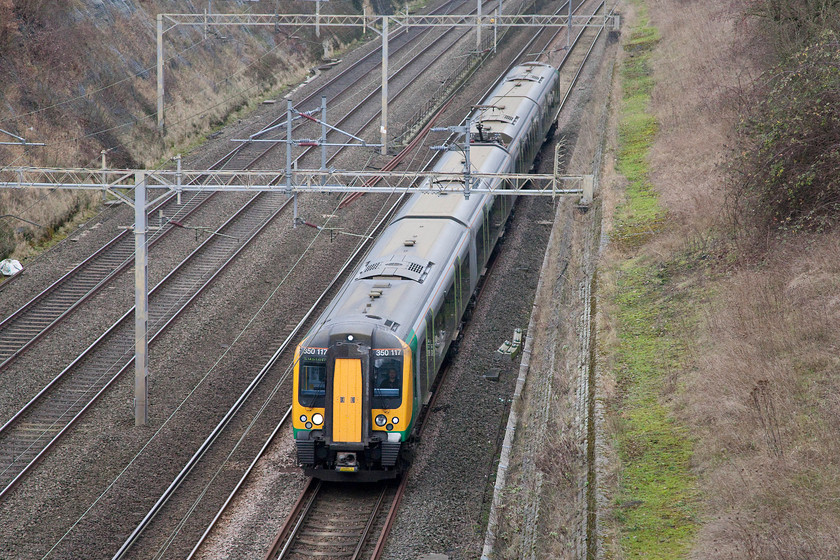 350117, LM 11.14 Birmingham New Street-London Euston (1Y34), Roade Cutting 
 350117 is about to reach the summit of the gentle but steady six mile 1:200 climb from Northampton as it passes though Roade Cutting. It is forming the 11.14 Birmingham New Street to London Euston. 
 Keywords: 350117 11.14 Birmingham New Street-London Euston 1Y34 Roade Cutting