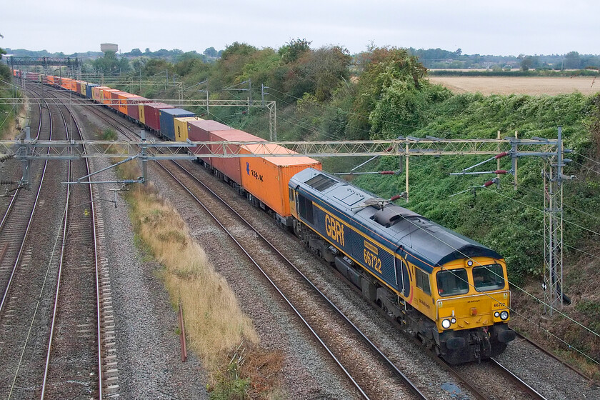 66722, 13.57 Birch Coppice-London Gateway (4L68, RT), Victoria bridge 
 66722 'Sir Edward Watkin' leads the daily 4L68 Birch Coppice to London Gateway GBRf 'liner service pst Victoria bridge between Roade and Ashton. It was named way back in December 2006 in a ceremony held at Euston station where 66718 'Gwyneth Dunwoody', 66719 'Metroland', 66720 'Metronet Pathfinder' and 66721 'Harry Beck' were also named. They all wore Metronet liveries, which 66722 did until the summer of 2014. 
 Keywords: 66722 13.57 Birch Coppice-London Gateway 4L68 Victoria bridge GBRf Sir Edward Watkin