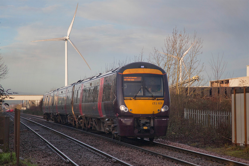 170101, XC 07.22 Birmingham New Street-Stansted Airport (1L30, RT), Kings Dyke crossing 
 It appears that 170101 has been adapted to operate using wind power! With a huge turbine emerging from its roof the CrossCountry class 170 approaches Kings Dyke level crossing between Peterborough and Whittlesey (or Whittlesea) forming the 07.22 Birmingham New Street to Stansted Airport. 
 Keywords: 170101 07.22 Birmingham New Street-Stansted Airport 1L30 Kings Dyke crossing CrossCountry trains