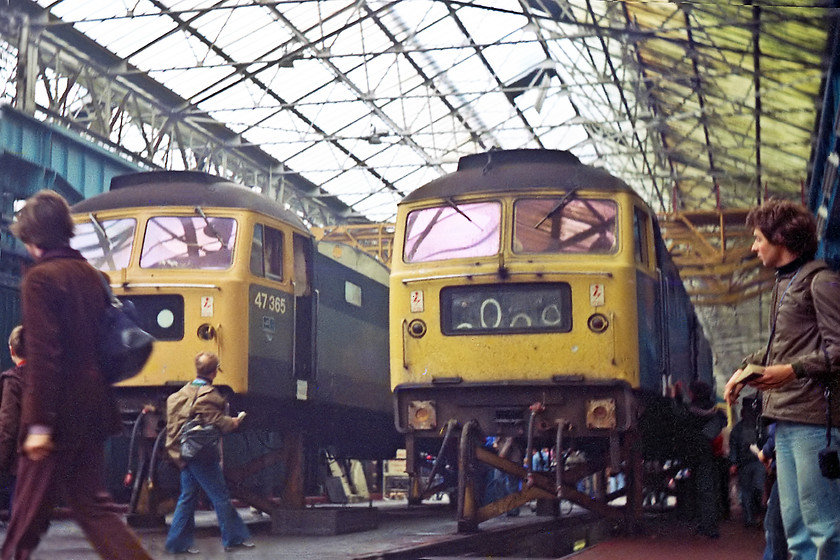 47365 & 47223, undergoing overhaul, Crewe Works 
 Nothing had quite prepared me for the experience of an open day! The crowds were huge and getting a clear picture proved a challenge. The other challenge was that the Exa camera's low light performance was abysmal! With my teacher, Mr. Brush, looking on 47365 and 47233 have been lifted from their bogies, had their internals removed and are well into a full overhaul. As can be seen, non-boilered 47365 is soon to lose its dual green livery in favour of BR blue. This locomotive survived on until 2007 after becoming an EWS engine. It was in long-term storage for many years. 47223 was steam heat engine that survived until 2005, again, after an extensive time in storage.