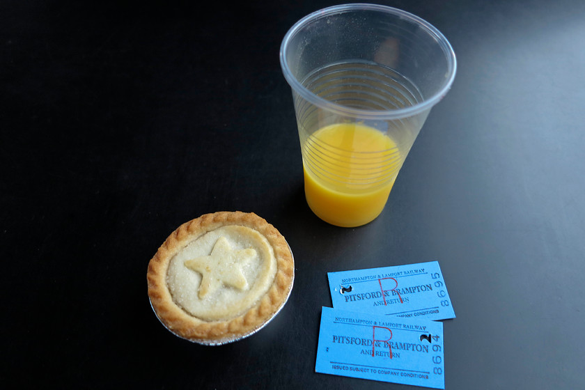 Tickets, mince pie & juice 
 Taken on-board the train are the tickets for the New Year's Day run on the Northampton and Lamport Railway. As I don't drink I opted for the orange juice rather than the sherry, the mince pie was smashing!