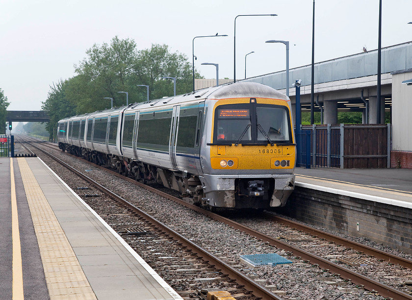 165005, CH 10.44 Oxford-London Marylebone (1Y17, 2L), Bicester Village station 
 With the Bicester Village car park in the background, 165005 draws into the station working the 10.44 Oxford to London Marylebone. This station, the track, the ballast, the infrastructure and just about everything is all new! This line has gone through a massive upgrade, partly in preparation for its extension to Claydon Junction, Bletchley and beyond as part of reinstating the Varsity Line. 
 Keywords: 165005 1Y17 Bicester Village station