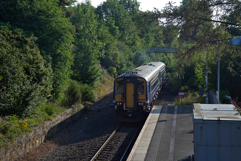 156450, SR 07.02 Stranraer-Glasgow Central (1A11, 1L), Maybole station 
 Maybole is a small town on the 'Road to Stranraer' about ten miles south of Ayr. Its most notable claim to fame is that is a very short distance from the birthplace of Robert Burns. The railway station was opened in 1860 by the Maybole and Girvan Railway. Here, 156450 leaves the station forming the 07.02 Stranraer to Glasgow Central. The old down platform can be seen to the left has become very overgrown since the line was singled in 1973 and it went out of use. 
 Keywords: 156450 1A11 Maybole station