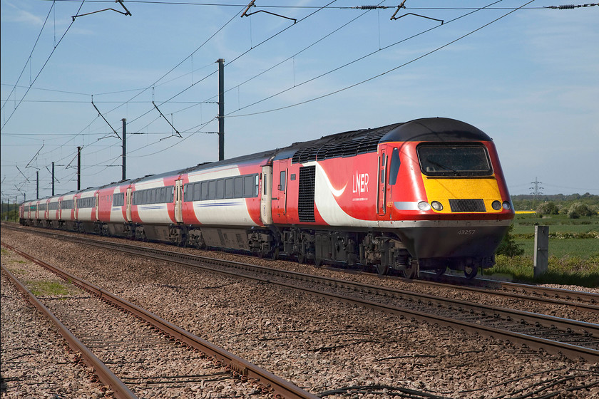 43257 & 43312, GR 07.55 Inverness-London King`s Cross (1E13, 15L), Barnby Lane SK850495 
 Under glorious spring skies, 43257 'Bounds Green' leads 43312 forming the 07.55 Inverness to King's Cross. The train is about to pass over Barnby Lane level crossing, the most northerly of the three in the village of Claypole. The leading power car was one of the two that made up the Eastern Region pioneer set, 254001, that was launched on the ECML in July 1977. I believe that this power car has been earning its keep on this route ever since clocking up millions of miles in the process; I wonder if anybody has any figures? 
 Keywords: 43257 43312 07.55 Inverness-London King`s Cross 1E13 Barnby Lane SK850495