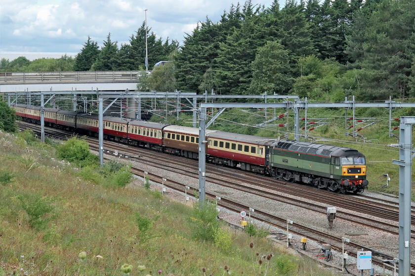 D1935, 09.21 Crewe HS-Southall LSL (5Z80, RT), Loughton Redway bridge 
 With Crewe-based LSL either operating so many charters or providing the stock for others they are operating ECS trains all over the country. One such train is seen passing through Milton Keynes from the Redway bridge with D1935 'Roger Hosking MA 1925-2013 leading. Unfortunately, this spot, close to where I was working, did not enable InterCity liveried 47828 to be seen on the rear of the 5Z80 09.21 Crewe HS to Southall LSL empty stock move. 
 Keywords: D1935 09.21 Crewe HS-Southall LSL 5Z80 Loughton Redway bridge Roger Hosking MA 1925-2013