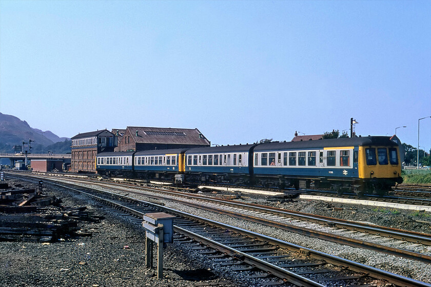 Class 108 DMUs, 14.07 Llandudno-Llandudno Junction, Llandudno Junction 
 A pair of Class 108 first-generation DMUs are seen working the 14.07 Llandudno to Llandudno Junction shuttle service approaching its destination. With just one intermediate stop at Deganwy the journey from end to end would only have taken about ten minutes with a four-car DMU combination (Including some first-class seating) providing ample accommodation! 
 Keywords: Class 108 DMUs 14.07 Llandudno-Llandudno Junction Llandudno Junction