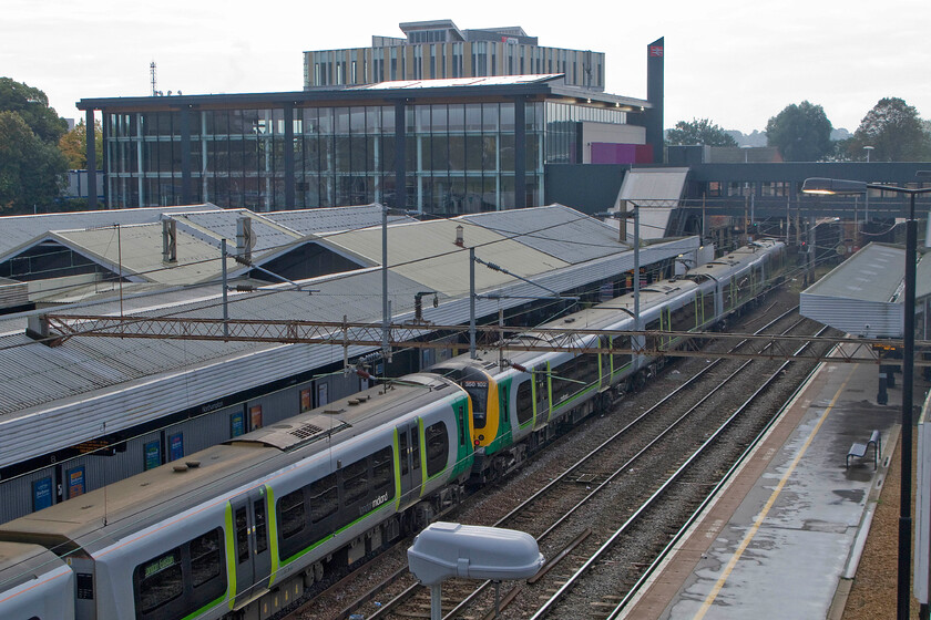 350120, for LM 08.54 Birmingham New Street-London Euston (2Y02) & 350102, LM 08.33 Birmingham New Street-London Euston (1W06), Northampton station 
 A view of Northampton station that will be lost sometime next year as the temporary station footbridge on which I am standing is removed following the opening of the new station structure seen in the background. To the left 350120 arrives as the 08.54 from Birmingham. This portion is then joining the slightly earlier 08.33 ex New Street with the pair then working forward to Euston. 
 Keywords: 350120 08.54 Birmingham New Street-London Euston 2Y02 350102 08.33 Birmingham New Street-London Euston 1W06 Northampton station