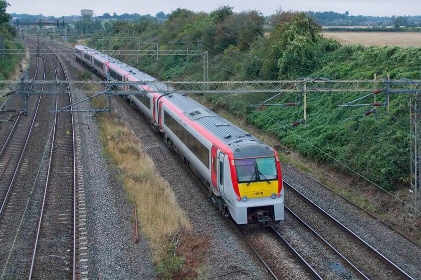 175111 & 175114, 10.02 Landore TMD-Ely Papworth Sidings (5Q36, 34L), Victoria bridge 
 With the Class 197s now in squadron service for TfW the Class 175s have been stood down. A number have already been moved away from their Welsh haunts to Ely for storage. Another pair of the units, 175111 and 175114, pass Victoria bridge near Roade making the journey as the 10.02 Landore to Papworth Sidings. Introduced in 2000, they may well be twenty-four years old now but eminently up for the job (despite their propensity to catch fire that is!) with scrapping surely not an option?

PS I have just read in Rail that GWR are looking to take some of the Class 175s on to replace their final 'short' HST Castle sets that operate in Cornwall. 
 Keywords: 175111 175114 10.02 Landore TMD-Ely Papworth Sidings 5Q36 Victoria bridge TfW