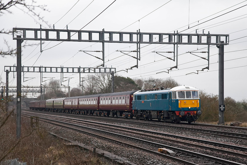 86259, outward leg of The Cathedrals Express, 07.10 London Euston-Carlisle (1Z86), Ashton Road Bridge 
 A grey and cold morning was not exactly inspiring me to get out with my camera, but when I only live a five minute walk from this location it is not much of challenge! 86259 'Les Ross/Peter Pan' heads the outward leg of The Cathedrals Express from London Euston to Carnforth for steam haulage to Carlisle; in the case of this railtour, Jubilee 46599 did the honours. 
 Keywords: 86259 The Cathedrals Express 1Z86 Ashton Road Bridge