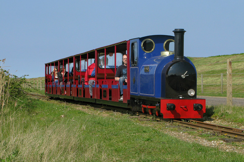 Howard, 14.50 Pinewoods-Wells-next-the Sea, Wells-next-the-Sea TF915443 
 'Howard' leads the rather lightly loaded 14.50 Pinewoods Hills to Wells Harbour (for Wells-next-the-sea) train along the straight track between the two stations. The one point one-kilometre long track was opened in 1976 and operates throughout the tourist season from March until October. 
 Keywords: Howard, 14.50 Pinewoods-Wells-next-the Sea, Wells-next-the-Sea TF915443 Wells Harbour Railway