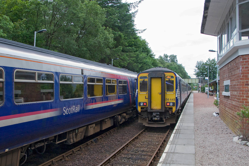 156456, SR 10.10 Mallaig-Glasgow Queen Street (1Y44) & 156445, SR 08.21 Glasgow Queen Street-Mallaig (1Y41), Spean Bridge station 
 A busy scene at Spean Bridge station northeast of Fort William sees 156456 to the left pausing with the 10.10 Mallaig to Glasgow Queen Street train. To the right, 156445 has been waiting for a few minutes with the 08.21 Glasgow to Mallaig. On the platform is the former signal box that tankfully was not knocked down when the line went over to RETB control in 1988. 
 Keywords: 156456 10.10 Mallaig-Glasgow Queen Street 1Y44 156445 08.21 Glasgow Queen Street-Mallaig 1Y41 Spean Bridge station ScotRail Sprinter