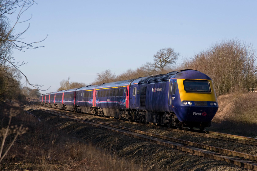 43017, GW 07.30 Camarthen-London Paddington (1L42), Knighton crossing SU276890 
 With the low winter sun creating some lovely dappled shadows, 43017 'Hannahs discoveringhannahs.org' leads the 07.30 Carmarthen to Paddington through the Oxfordshire countryside. The train is seen passing the site of the former Knighton level crossing located between Uffington and Watchfield. This power car carried another name when it was in its Executive livery, then it was named 'HTV West' after the local independent dual television franchise that I grew up watching living near Bath. 
 Keywords: 43017 07.30 Camarthen-London Paddington 1L42 Knighton crossing SU276890