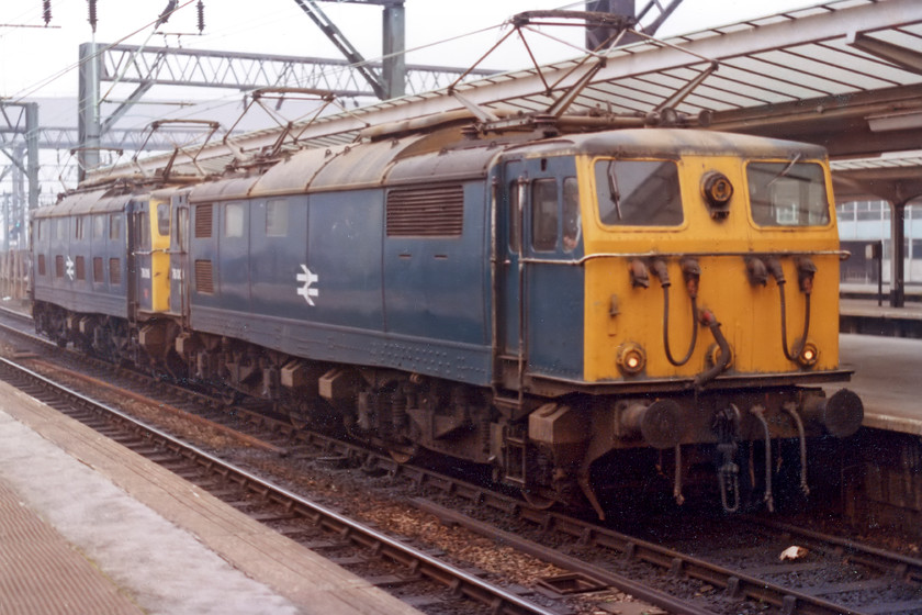 76009 & 76014, waiting to haul the Pennine Explorer, Cardiff Central-Rotherwood, Manchester Piccadilly station (Courtesy of David Brush) 
 This is a scan of an original print provided to me by my teacher from school Mr. Brush. It shows 76009 and 76014 waiting at Manchester Piccadilly to join the front of the Pennine Explorer railtour that they would haul across the Woodhead route to the sheffield area. 
 Keywords: 76009 76014 Pennine Explorer Cardiff Central-Rotherwood Manchester Piccadilly station (Courtesy of David Brush)