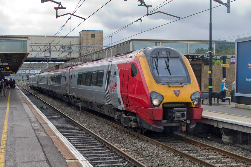 221103, VT 12.14 Milton Keynes Central-Glasgow Central 9S65 cancleled from London Euston, Milton Keynes Central station 
 Due to severe problems in and around Euston Virgin trains were terminating some services early and then returning them north again. 22103 Christopher Columbus is seen at Milton Keynes having been terminated earlier and now heading back as the 12.14 to Glasgow Central. Incidents such as this often afflict the railways, its part of their operational life, but the key to maintaining passenger confidence is communication. Sadly, this was missing today with my knowledge of the workings railway enabling me to make it to my destination via other routes rather than staff telling offering me advice and information. 
 Keywords: 221103 12.14 Milton Keynes Central-Glasgow Central 9S65 Milton Keynes Central station Virgin Voyager