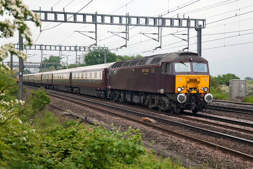 57313, return leg of the Northern Belle, 17.37 London Victoria-Chester (1Z48), Ashton Road bridge 
 57313 leads the 17.37 London Victoria to Chester Northern Belle past Roade between Northampton and Milton Keynes. I don't like the drab and uninspiring livery that these West Coast 57s carry but the Northern Belle stock looks very smart. This 57 was formally a Virgin Thunderbird named 'Tracy Island'. 
 Keywords: 57313 The Northern Belle 17.37 London Victoria-Chester 1Z48 Ashton Road Bridge