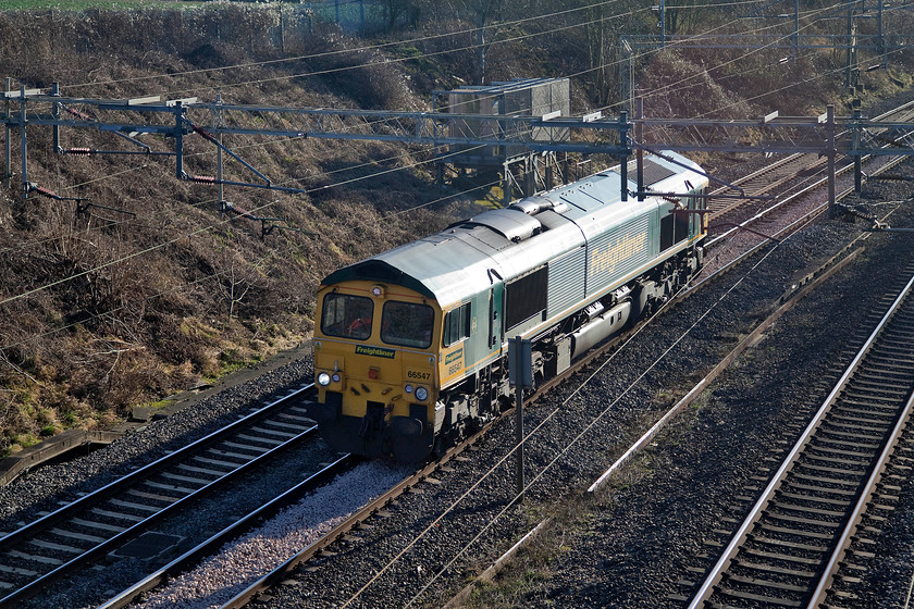 66547, 10.05 Willesden-Crewe Basford Hall light engine, Victoria Bridge 
 A true winter glintshot at Victoria Bridge on the WCML near to Roade in Northamptonshire. Freightliner 66547 runs light engine from Willesden to Crewe Basford Hall. 
 Keywords: 66547 light engine Victoria Bridge Roade WCML