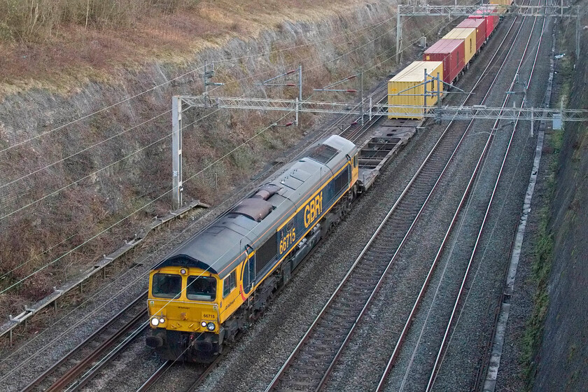 66715, 12.18 London Gateway-Hams Hall (4M47, 13L), Roade cutting 
 For the second time in less than a week 66715 'Valour. In Memory of all Railway Employees Who Gave Their Lives For Their Country' is captured locally on a down 'liner working. On this day it is seen leading the 4M47 12.18 London Gateway to Hams Hall service passing through Roade cutting. Apologies for the poor framing. 
 Keywords: 66715 12.18 London Gateway-Hams Hall 4M47 Roade cutting GBRf Valour. In Memory of all Railway Employees Who Gave Their Lives For Their Country