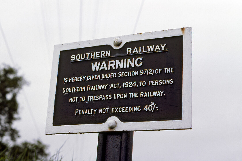 Ex SR trespass sign, Whimple SY047974 
 The Southern Railway was established as part of the 1923 grouping and operated in that guise until nationalisation in 1948. At its very youngest, when this cast sign was photographed at Whimple station in 1981 it would have been thirty-three years old but at its oldest closer to sixty! There would have been thousands of cast signs of various types all around the country most of which simply disappeared but some would have been saved and now are part of private collections. 
 Keywords: Ex SR trespass sign Whimple SY047974 cast iron