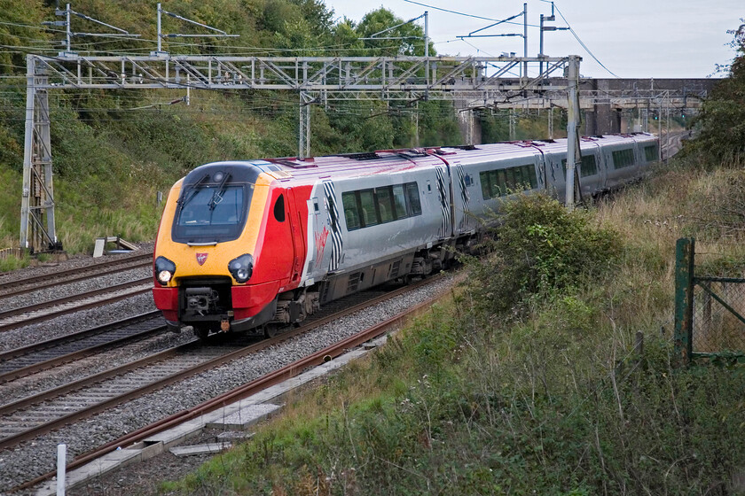 221111, VT 16.33 London Euston-Preston, Roade 
 221111 'Roald Amundsen' approaches Roade working the Virgin West Coast 16.33 Euston to Preston service. Even though there is no clear unbroken sky the clouds is thin allowing some really soft winter light through. This contributes towards making this time of year one of my favourites from the point of view of railway photography at least. 
 Keywords: 221111 16.33 London Euston-Preston Roade Roald Amundsen