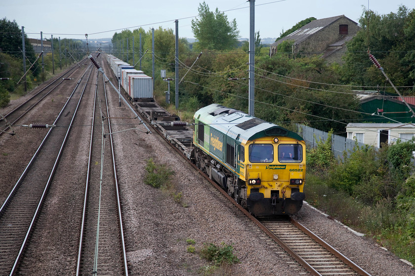 66522, unidentified down Freightliner, Arlesey Footbridge 
 Despite all the technology available, Andy and I could not identify this Freightliner working. If anybody can help, it is seen heading north past Arlesey on the ECML at 08.55. On this particular day, it is headed by 66522 wearing its Freightliner - Shanks livery. 
 Keywords: 66522 unidentified down Freightliner Arlesey Footbridge