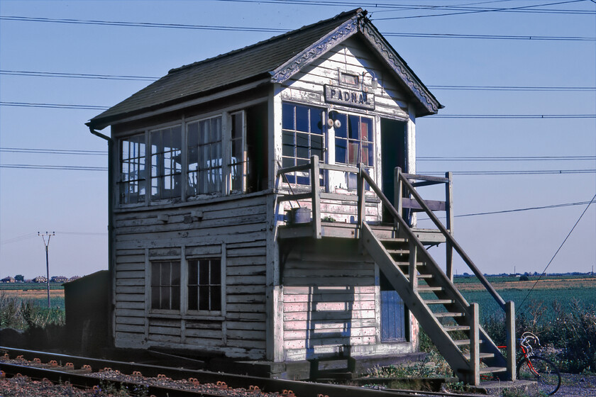 Padnal signal box (GE, 1887) 
 Padnal signal box was an intermediate block post located between Ely North Junction and Shippea Hill. The remote Great Eastern box was built in 1887 and operated until December 1989 when it was destroyed by a fire. It was never rebuilt with the block post simply extended and the level crossing adjacent to the box becoming user-controlled. Notice the signalman's red drop handlebar 'racer' leaning against the steps of the box. 
 Keywords: Padnal signal box GE Great Eastern