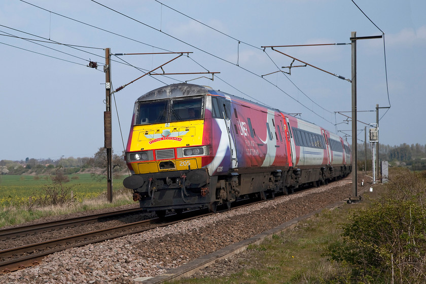 82205, GR 06.48 Glasgow Central-London King`s Cross (1E08, 6L), Eaton Lane crossing SK723779 
 Adorned with the Flying Scotsman thistle and a Saltire on the cab side, DVT 82205 leads the 06.48 Glasgow Central to King's Cross. The train is leaning into the sharp right-hand curve just south of Retford. This superb spot is a crossing where a bridleway traverses the line known as Eaton Lane crossing. It affords superb views of the line in both directions but is more impressive for southbound trains due to the curve as seen here. 
 Keywords: 82205 06.48 Glasgow Central-London King`s Cross 1E08 Eaton Lane crossing SK723779