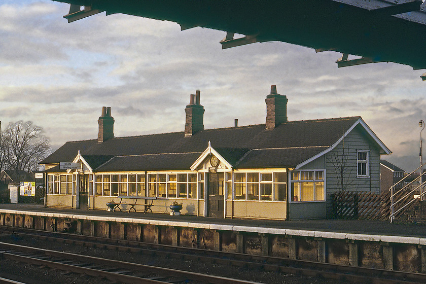 Gilberdyke Station building 
 The superb station building located on Gilberdyke's down platform is seen catching some afternoon (according to the station clock approaching 15.00) winter sunshine. At this time, there were four tracks on this section of line but this has now been reduced to two. The lovely building has been demolished and the platform abandoned along with the super old footbridge. Up until 1974, it was known as Staddlethorpe station and also had a large yard located to the south side that served the adjacent Staddlethorpe pole yard, where telegraph poles were dipped in creosote; it must have been a malodorous place to live! 
 Keywords: Gilberdyke Station building