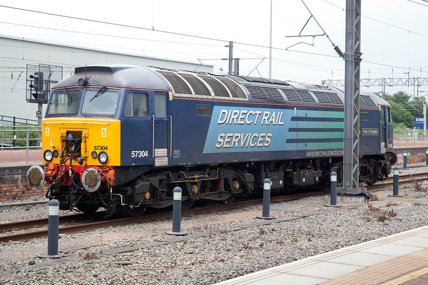 57304, stabled Thunderbird, Rugby station 
 57304 'Pride of Cheshire' is seen stabled at Rugby. It is pretty common to see a DRS class 57 stabled at Rugby ready to undertake Thunderbird duties should there be a failure of a Pendolino or Voyager on the busy WCML. 
 Keywords: 57304, Thunderbird Rugby station