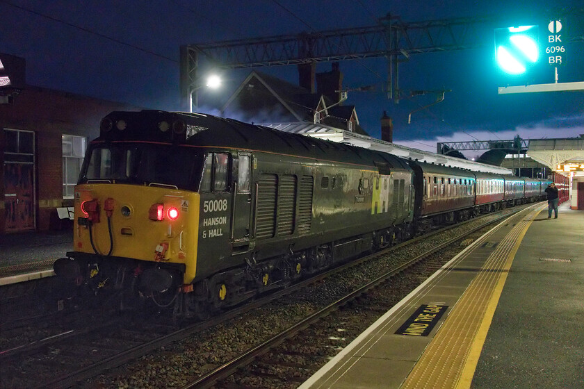 50008, outward leg of 'The Wolf Hall Thunderer', 05.25 Derby-London St. Pancras (1Z40, 10L), Kettering station 
 Attracting very little attention at the rear of The Wolf Hall Thunderer charter 50008 'Thunderer' sits waiting to get its turn to haul the train. This would happen on arrival at St. Pancras' platform three where it would then lead the 1Z41 leg of the tour to Shepperton via the fabled North London Dudding Hill Line. 
 Keywords: 50008 The Wolf Hall Thunderer', 05.25 Derby-London St. Pancras 1Z40 Kettering station