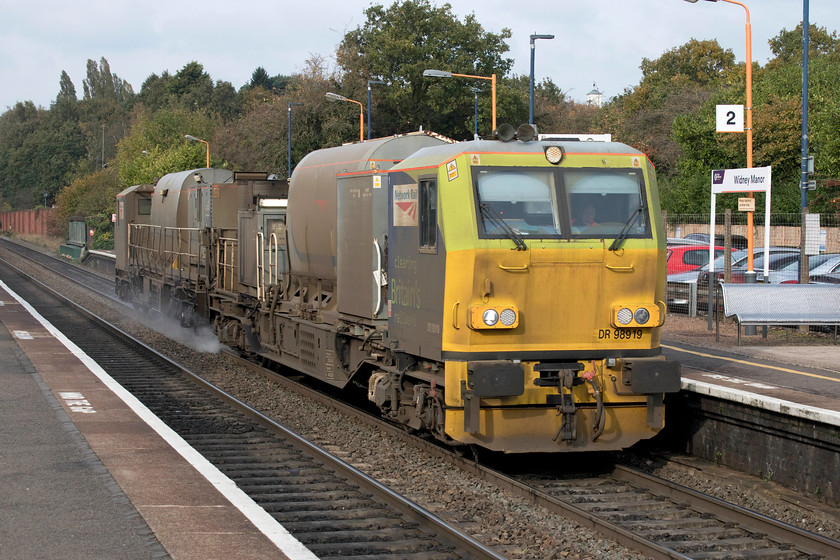 DR98919, 08.49 King`s Norton Depot-King`s Norton Depot, Widney Manor station 
 Over the years that the railhead treatment trains have been running I have secured precious few images of them, they seem to elude me running at short notice. I had spotted this working on Realtime Trains and realised that it could be an RHT train despite it not having an identifiable headcode. DR98919 is one of a number of MPVs that were ordered by Railtrack in the early 2000s. They were constructed in Germany by Windhoff and have proved to be successful on the network including the high output wiring train units used on the WCML during the early 2000s, however, these units are now stored. DR98919 and DR98969 work the 08.49 King's Norton out and back working that went as far as Lemington Spa working via Worcester and the so-called Dark Side route into Birmingham via Stourbridge. 
 Keywords: DR98919 08.49 King`s Norton Depot Widney Manor station