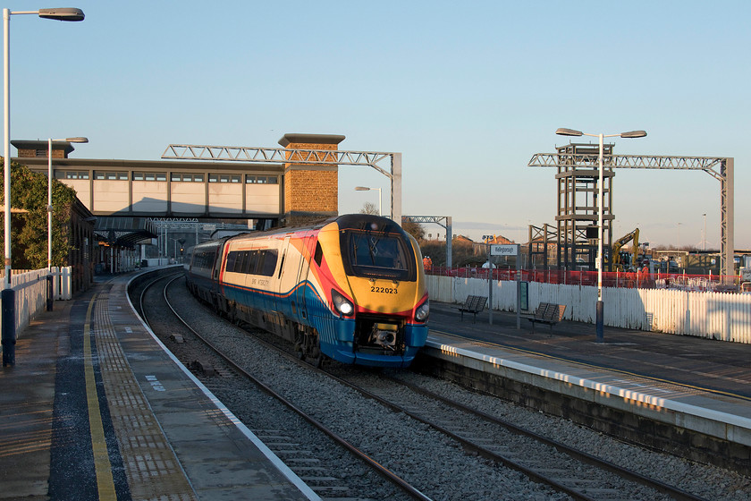 222023, EM 14.12 Nottingham-London St. Pancras (1B51, 1E), Wellingborough station 
 222023 pauses at Wellingborough station forming the 14.12 Nottingham to St. Pancras. In this image, deliberately with the subject slightly off centre of the frame, the extensive works taking place at the station are in view. As well as the stanchions for the electrification wiring, the steel tower that will act as the frame for the lift tower on the new platform four is in place. Soon, it will be clad in ironstone blocks to match the other two towers and the covered bridge will then be installed to unite them. 
 Keywords: 222023 14.12 Nottingham-London St. Pancras 1B51 Wellingborough station