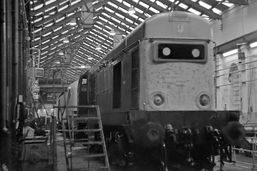 20142 & 254028, Crewe Works 
 20142 receives attention at Crewe works whilst one of the new Eastern Region HST power cars nears completion behind it. The HST was either 43110 (43310) or 43111 (43311) as part of set 254028. At the time of writing all the locomotives in this image are still with us and mainline registered, the HST is still storming up and down the ECML whilst the 20 is painted in a totally inauthentic London Underground livery. 
 Keywords: 20142 254028Crewe Works