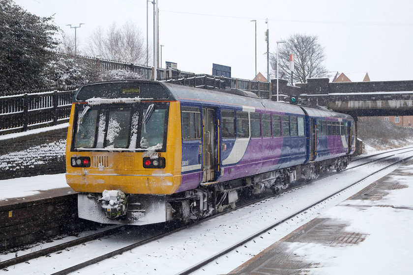 142028, NT 10.33 Leeds-Sheffield (2L27, 6L), Wombwell station 
 Northern Rail Pacer 142028 leaves Wombwell station working the 2L67 10.33 Leeds to Sheffield. Despite the appalling weather conditions, there were a fair few passengers getting about using the trains that were infinitely more reliable than the moaning minions seem to want us to believe. 
 Keywords: 142028 2L27 Wombwell station