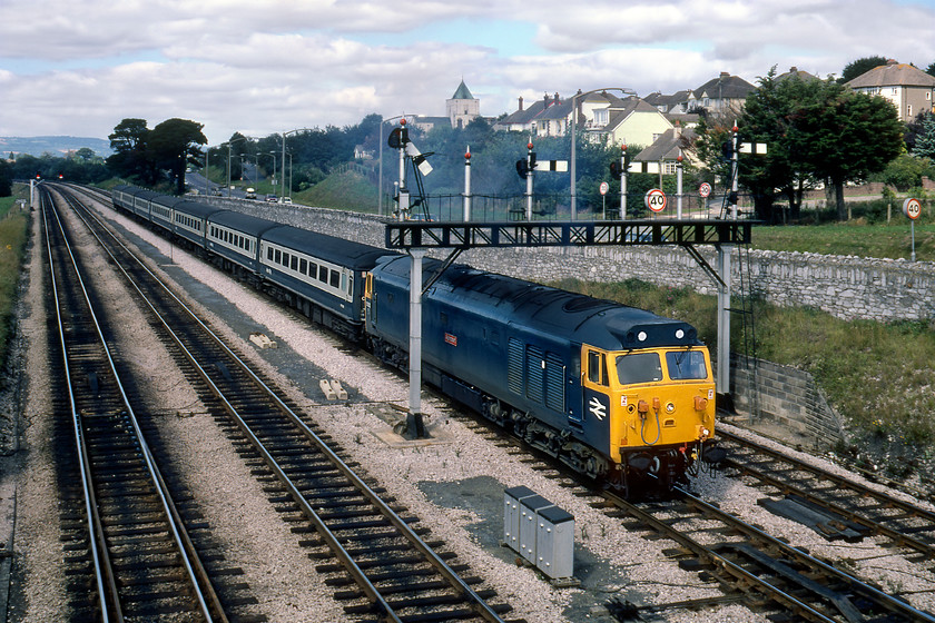 50013, unidentified Penzance working, Aller Junction 
 The driver has just opened the power handle on 50013 'Agincourt' at Aller Junction. The train had been held at the signal for a short time so the driver would have been eager to get away heading onwards to either Plymouth or Penzance. 50103 has its high-intensity headlight fitted meaning that it has gone through Doncaster works as part of the Class 50 overhaul programme. Indeed, it had left the plant only two months previously and would remain in service for another eight years receiving its large logo livery in between.

There is an audio recording of this event on my youtube channel, see..... https://youtu.be/-QL7oNWtYEg 
 Keywords: 50013 Penzance working Aller Junction Agincourt