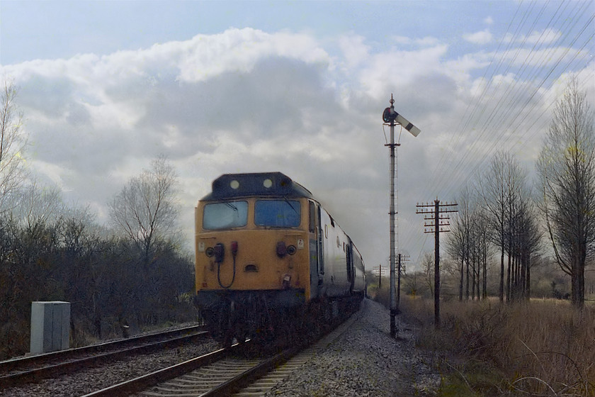 50014, unidentified up working, Hamstead crossing 
 Unfortunately, taken into the afternoon light but the image is historic in that the home semaphore at Hamstead in Berkshire had less than 12 hours of use before being decommissioned with the block post being abolished. 50014 heads east with an unidentified up working. Notice the lines of lime trees to the right. 
 Keywords: 50014 up working Hamstead crossing