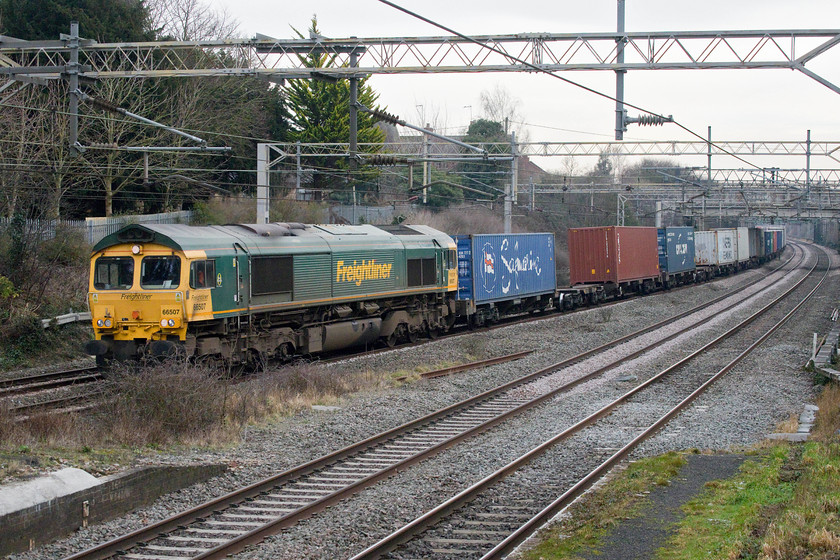 66507, 07.50 Felixstowe North-Lawley Street (4M94), site of Castlethorpe station 
 The 4M94 07.50 Felixstowe North to Lawley Street Freightliner passes the site of Castlethorpe's closed station with 66507 at the front. This particular class 66 is almost the same age as my son, both arriving in the UK during mid 2000! 
 Keywords: 66507 07.50 Felixstowe North-Lawley Street 4M94 site of Castlethorpe station