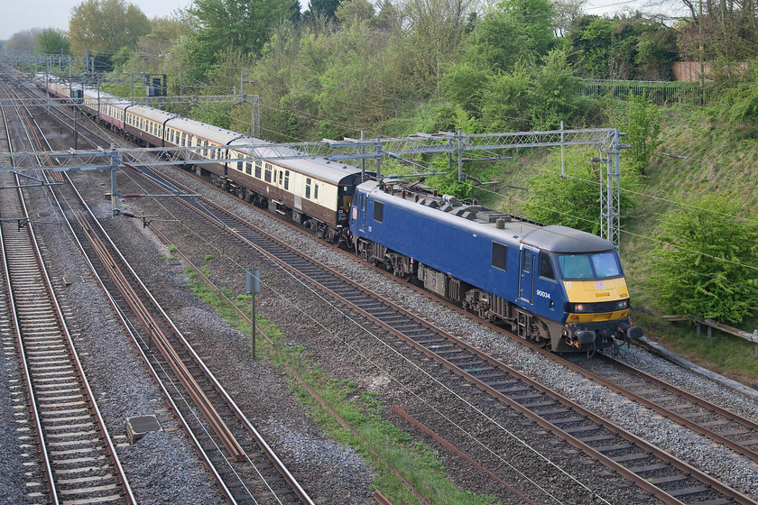 90034, outward leg of The Conwy Explorer, 06.35 London Euston-Blaenau Ffestiniog (1Z77), Victoria Bridge 
 90034 leads a nice uniform rake of Mk.I stock past Victoria Bridge just north of Hanslope Junction on the southern WCML. It was heading the UK Railtour's 'The Conwy Explorer' from Euston to North Wales. It hauled the train as far as Crewe where 66105 and 66149 took over. 
 Keywords: 90034 The Conwy Explorer 06.35 London Euston-Blaenau Ffestiniog 1Z77 Victoria Bridge